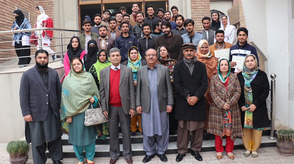 The Vice Chancellor University of Peshawar Prof. Dr. Muhammad Asif Khan is posing with the faculty members of Psychology department and winners of sports gala, while on a detailed visit on 18th January, 2019 at the Psychology department